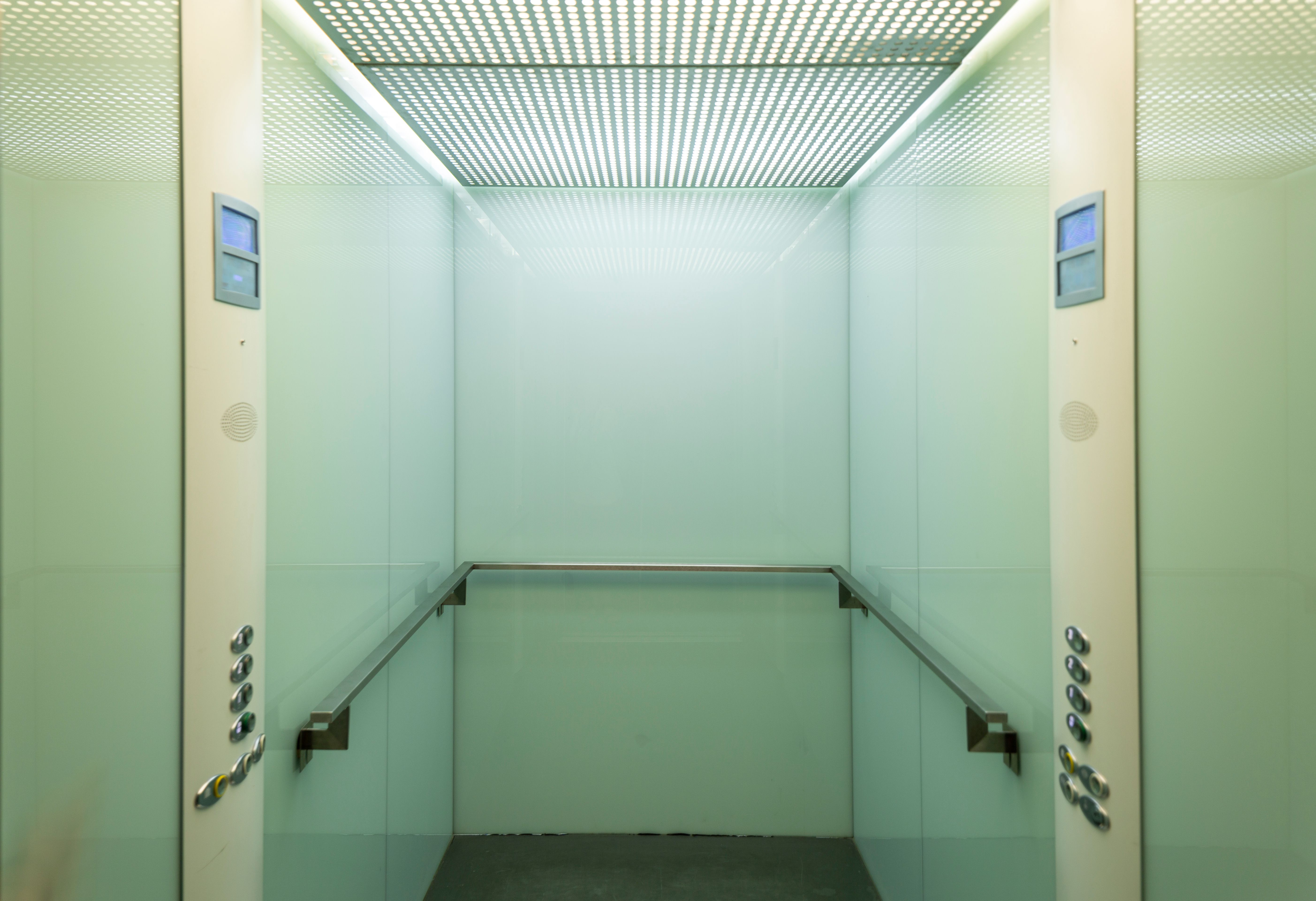 Interior of a compact service lift cabin used for back-of-house vertical transport